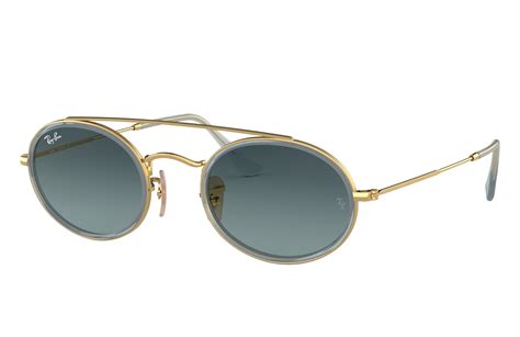 Oval Double Bridge Sunglasses in Arista Gold and Blue  .